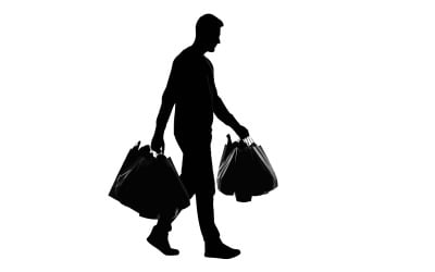 Silhouette of shopper carrying multiple bags during busy retail day isolated on white background