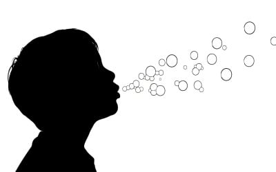 Silhouette of a child blowing bubbles with mouth isolated on white background