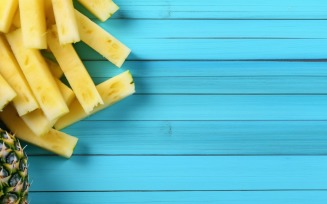 Pineapple on light blue wooden background 012