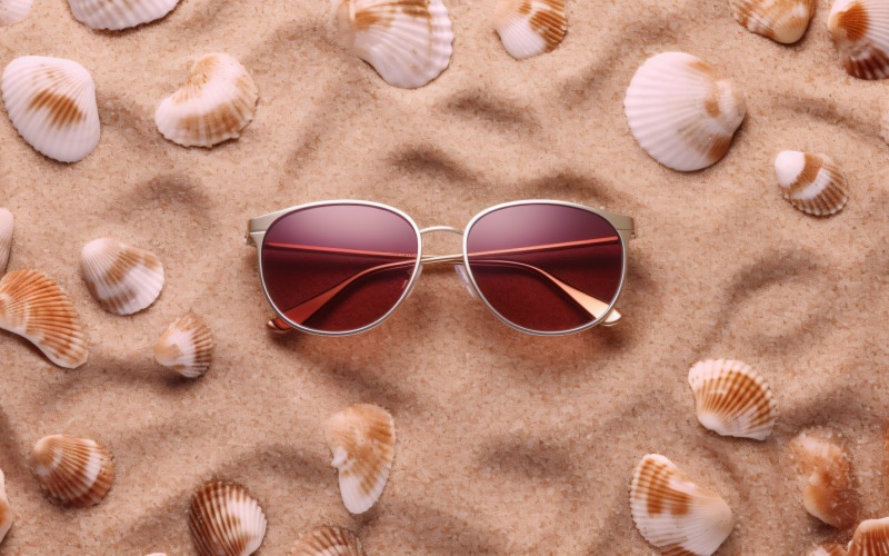 Sunglasses seashells and beach accessories on sandy beach 194 Illustration
