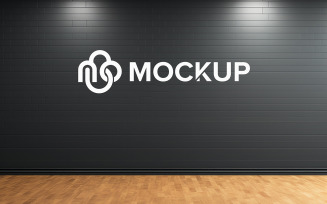 Logo mockup on black wall with wooden floor psd