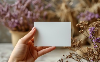 White Paper Held Against Dried Flowers Card Mockup 82