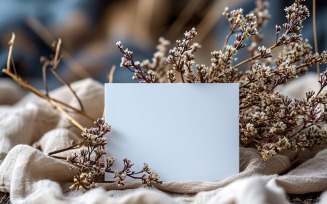 White Paper Held Against Dried Flowers Card Mockup 84