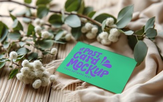 Post card Mockup with dried Flowers on The Wooden table 232