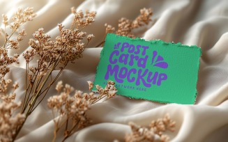 Post card mockup with dried flowers on the silk cloth 304