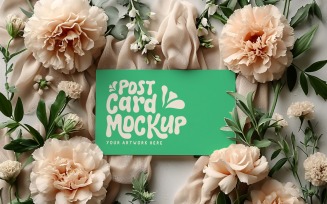 Post caard mockup flatlay with flowers on the cloth 321