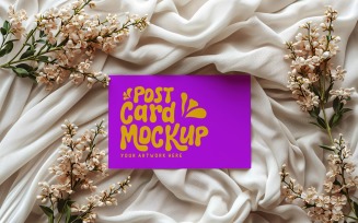 Post card mockup with dried flowers on the silk cloth 382