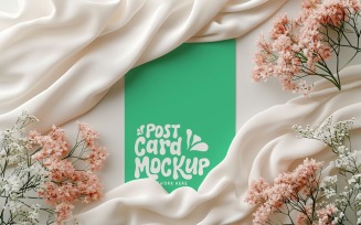 Post card mockup with dried flowers on the silk cloth 387
