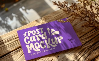 Post card mockup with dried flowers on the wooden table 330