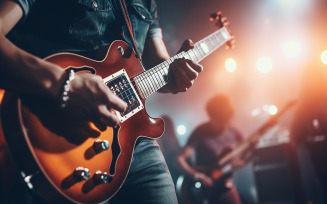 A guitar player making rock during concert. Rock band performs on stage