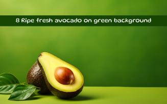 Ripe fresh avocado on green background