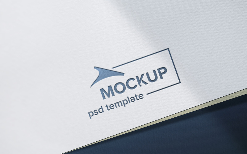 Debossed grey logo mockup on white craft paper texture