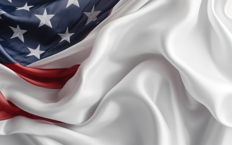 Zblízka mávající vlajka USA v rohu s prostorem pro kopírování 30